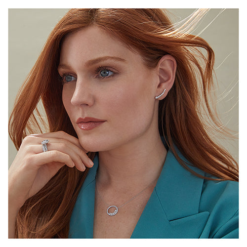 Sterling Silver Graduated Rub Over Set CZ Stud earrings