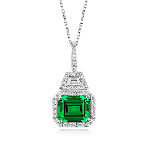 DECO HALO STYLE PENDANT. 10X8MM GREEN EMERALD CUT ON RUNNING CHAIN
