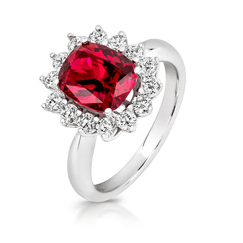CLUSTER RING.10X8MM RED CENTRE. 14X2.5MM ROUND STONES