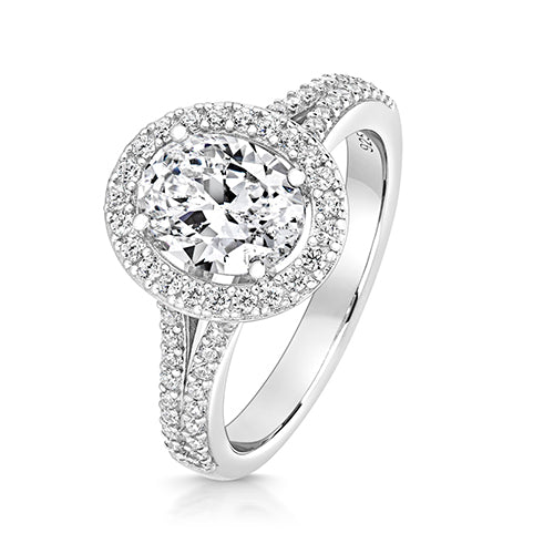 9X7MM OVAL HALO STYLE RING WITH PAVE SET SPLIT SHOULDERS