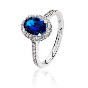 Sterling Silver Small Claw Set Oval Shape Halo Style Blue CZ Ring